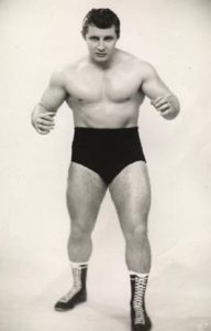 Eddie Sharkey posing in black trunks