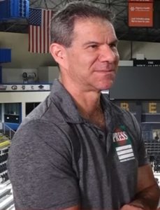 Dave Meltzer wearing a grey polo shirt