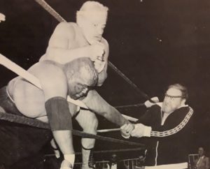 Iron Sheik wrestles Abdullah the Butcher on the ropes. Black and white photo