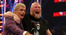 Lesnar puts his arm around Rhodes